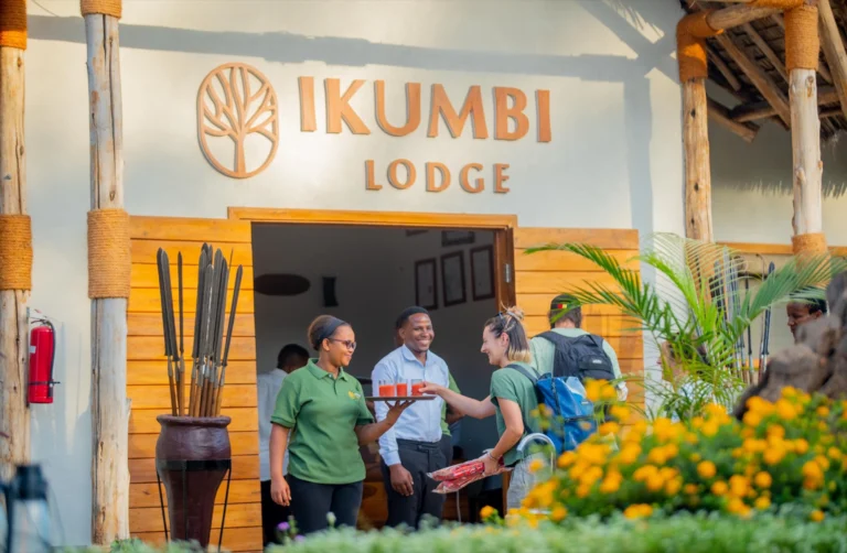 Staff welcoming arriving guests with drinks