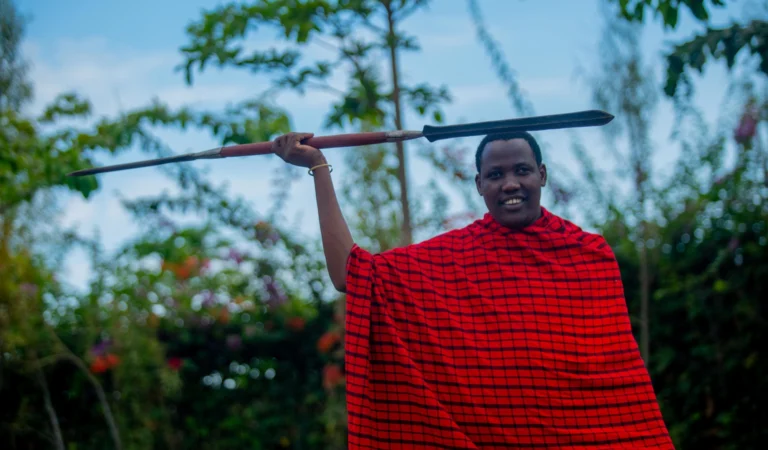 A Maasai warrior in a red shuka at the lodge