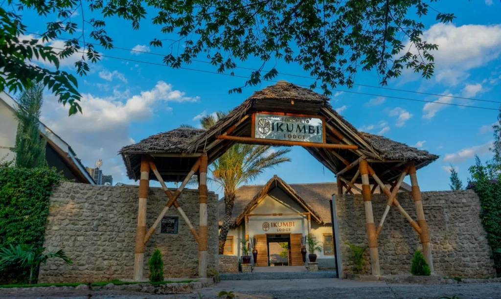 View through the Welcome to Ikumbi Lodge gate