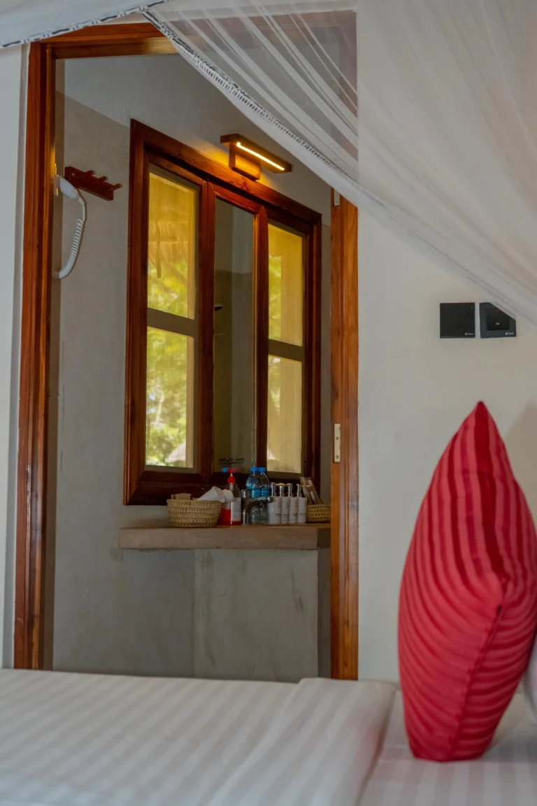 View from the bed into the bathroom vanity