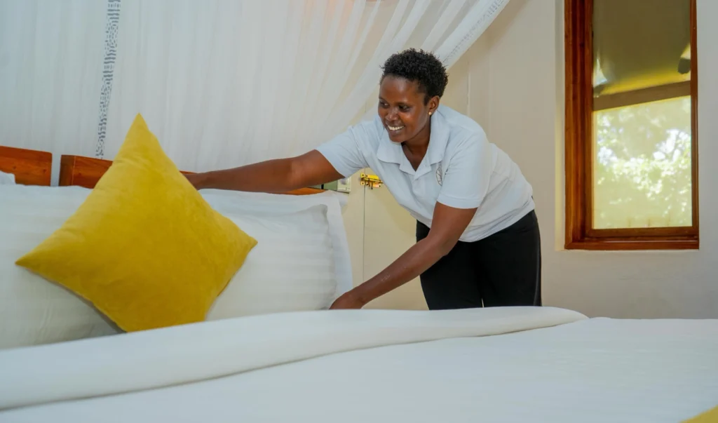 A housekeeper preparing a room